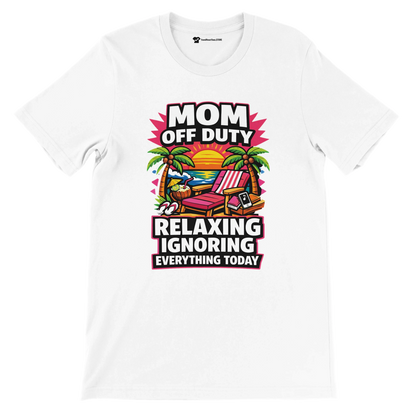White T-shirt with 'Mom Off Duty Relaxing Ignoring Everything Today' text, beach chair, palm tree, sunset graphic.