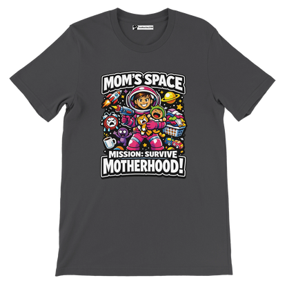 Dark t-shirt featuring a cartoon mom astronaut with playful space and motherhood graphics, text reads 'Mom's Space Mission: Survive Motherhood!'