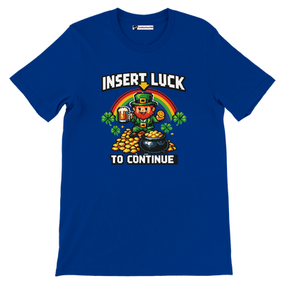 Blue tee with pixel art leprechaun, rainbow, coins, and 'Insert Luck to Continue' text for St. Patrick's Day.