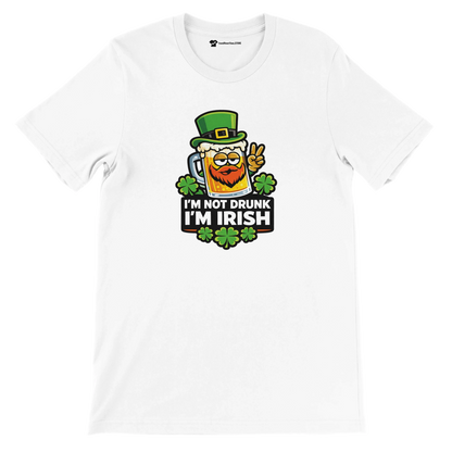 White t-shirt with 'I'm Not Drunk I'm Irish' design, beer mug, green hat, and shamrocks for St. Patrick's Day.