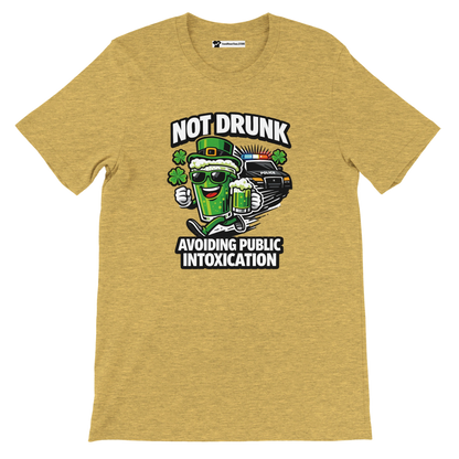 Yellow tee with cartoon beer mug, police car, shamrocks and 'Not Drunk Avoiding Public Intoxication' text.