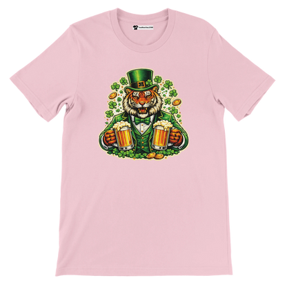 Pink t-shirt with a cartoon tiger in a green St. Patrick's Day outfit holding beer mugs, surrounded by shamrocks and gold coins.