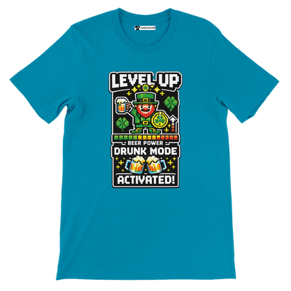 Teal t-shirt with pixel art leprechaun, beer, shamrocks, 'Level Up Drunk Mode Activated' text for St. Patrick's Day fun
