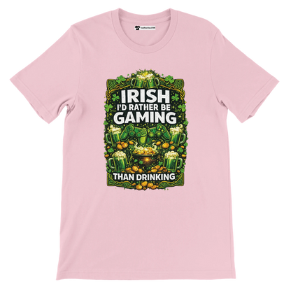 Pink Irish gaming tee with shamrocks, beer mugs, gold coins, and controllers for St. Patrick's Day.