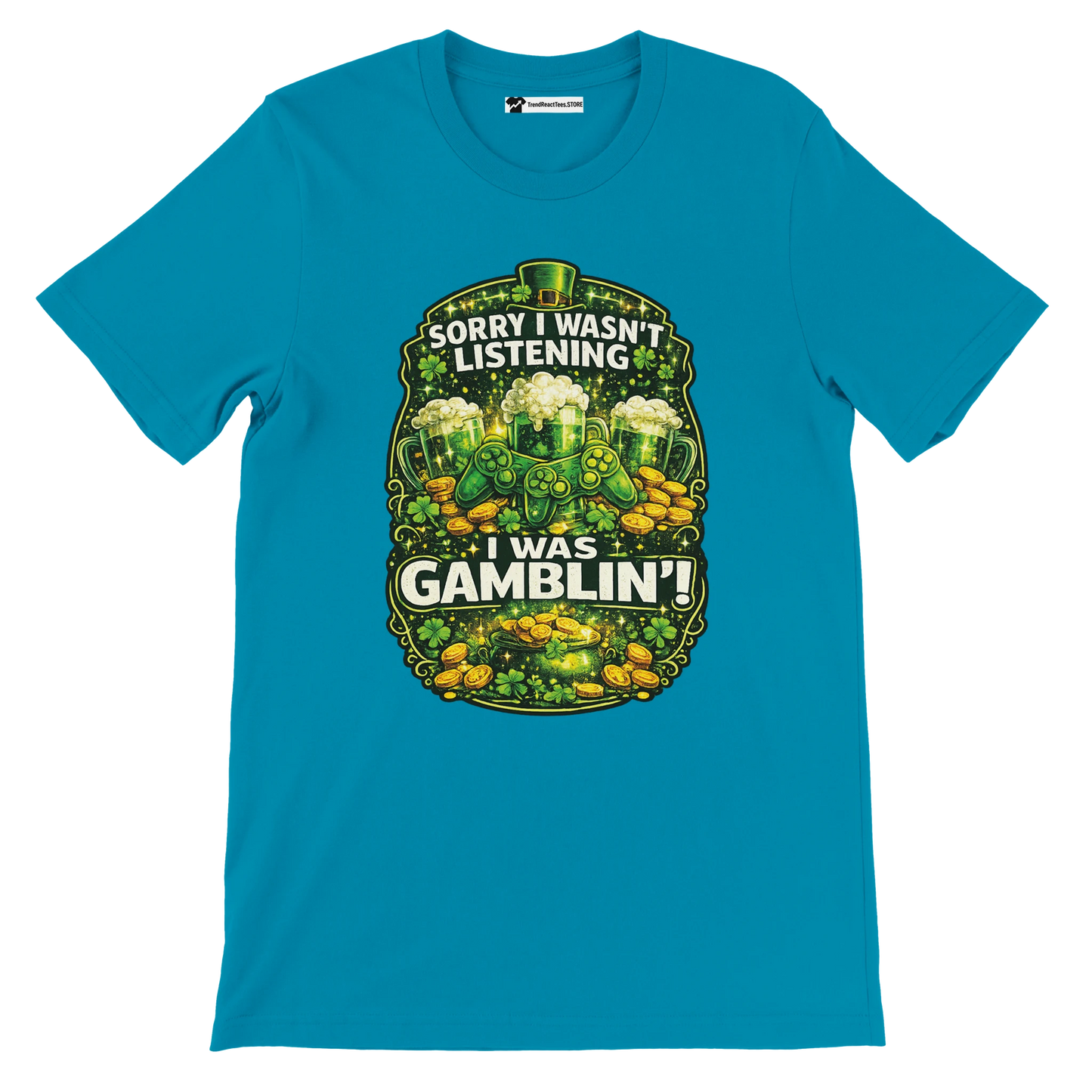 Blue St. Patrick's Day tee with shamrocks, gold coins, beer mugs, and 'Sorry I Wasn't Listening I Was Gamblin'' quote.