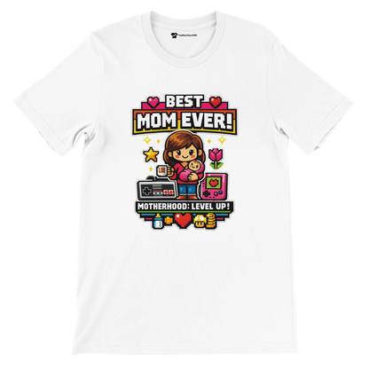 White T-shirt with pixel art of mom and baby, gaming icons, text 'Best Mom Ever!' and 'Motherhood: Level Up!'
