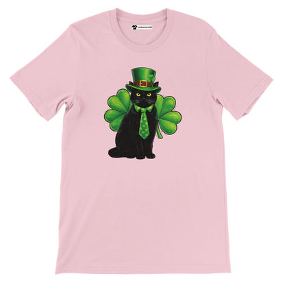Pink tee with black cat wearing green hat, shamrock tie, and large clover leaves print