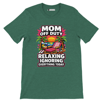 Green t-shirt with 'Mom Off Duty' tropical beach scene, relaxing chair, sunset illustration