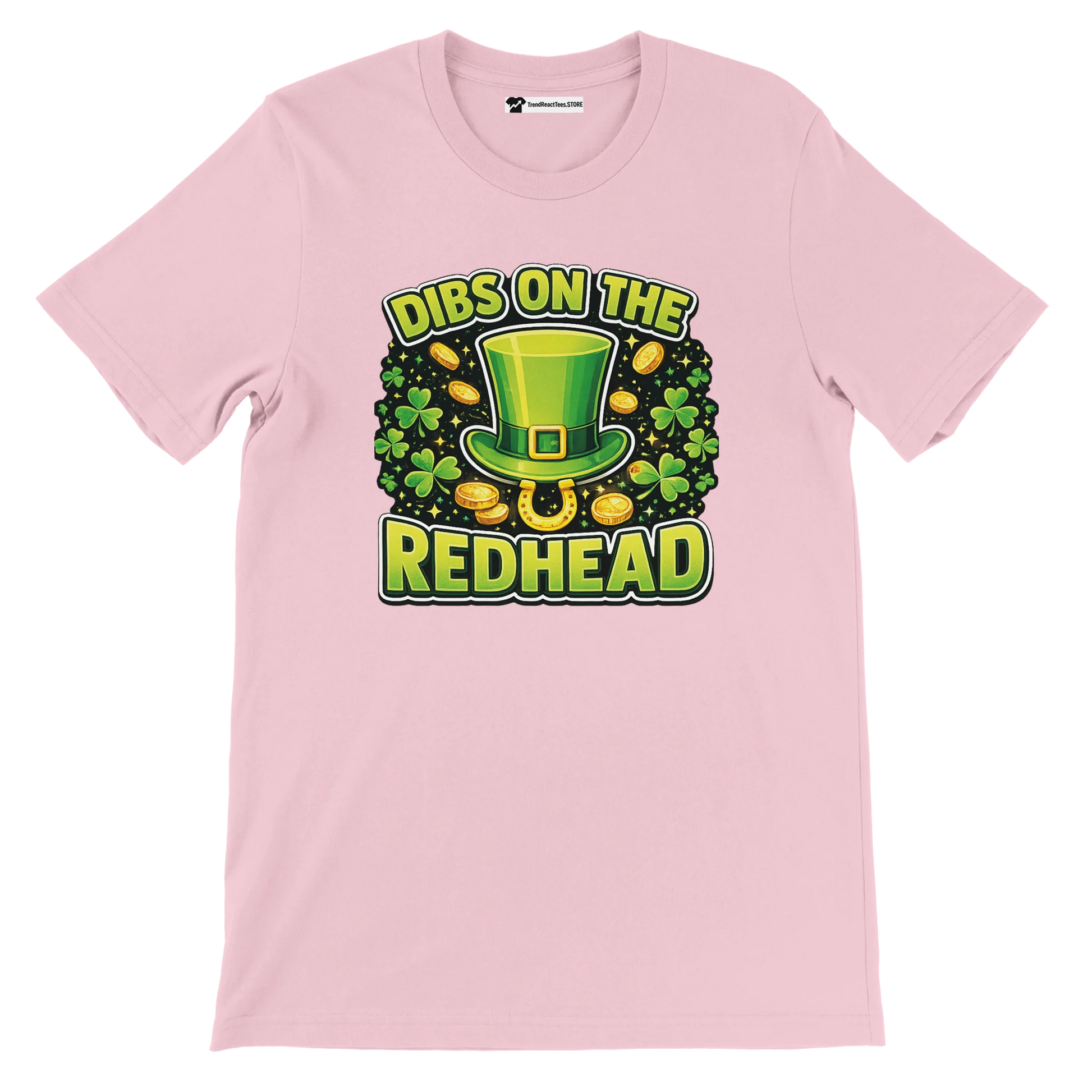 Pink t-shirt with St. Patrick's Day design, green leprechaun hat, shamrocks, gold coins, and 'Dibs on the Redhead' quote.