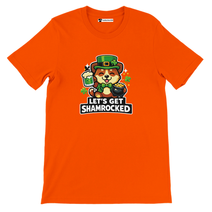 Orange t-shirt featuring cute dog in leprechaun hat, beer, gold pot, and 'Let's Get Shamrocked' text