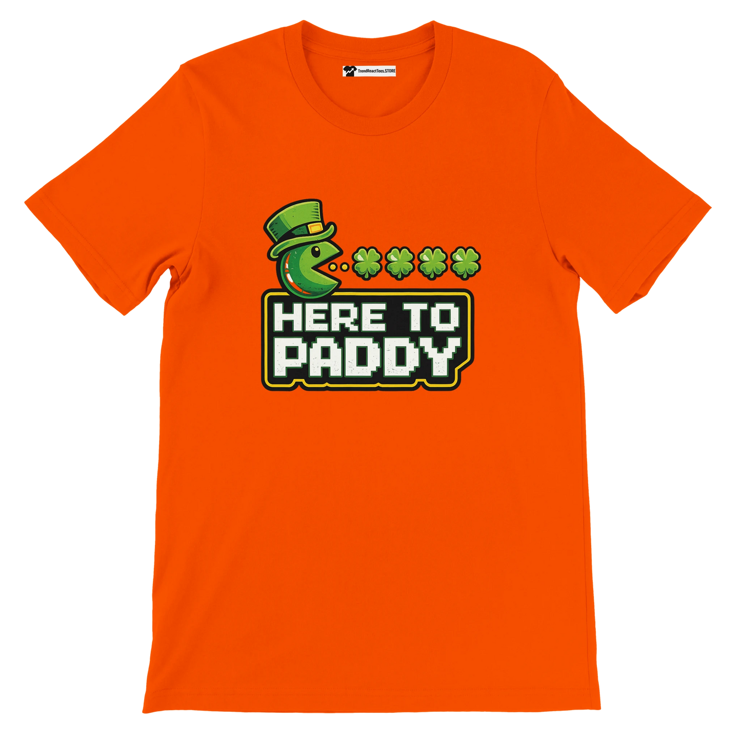 Orange St. Patrick's Day tee with Pac-Man eating shamrocks, 'Here to Paddy' text, green hat graphic