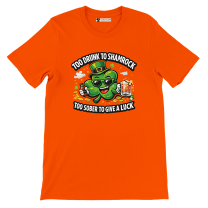 Orange t-shirt with cartoon shamrock holding beer, St. Patrick's Day quote, festive design