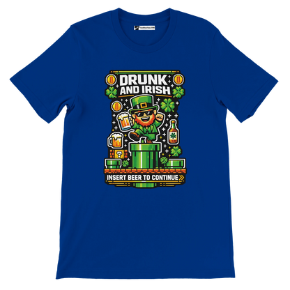 Blue t-shirt with 'Drunk and Irish' pixel art leprechaun, shamrocks, beer, and 'Insert Beer to Continue' text for St. Patrick's Day.