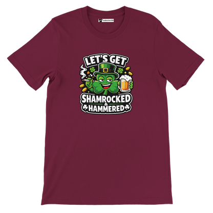 Maroon t-shirt with cartoon shamrock in leprechaun hat, beer mug, and 'Let's Get Shamrocked & Hammered' text.
