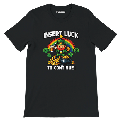 Black t-shirt with pixel art leprechaun, rainbow, gold coins, and 'Insert Luck to Continue' text