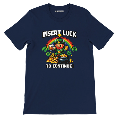 Navy blue St. Patrick's Day t-shirt with pixel art leprechaun, rainbow, gold coins, and 'Insert Luck to Continue' text.