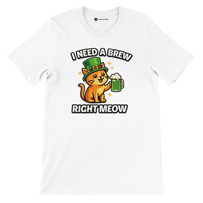White t-shirt with cute orange cat in leprechaun hat holding green beer, text says I need a brew right meow