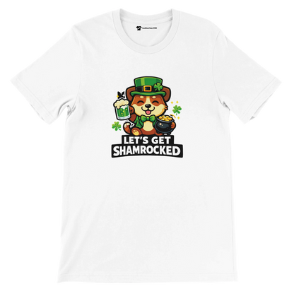White t-shirt with cute dog in leprechaun hat, shamrocks, beer, pot of gold, and 'Let’s Get Shamrocked' text.