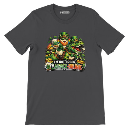 St. Patrick's Day t-shirt with leprechaun riding dinosaur, shamrocks, gold coins, and 'I'm not sober, I'm alpaca-drunk' text