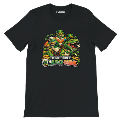 Funny St. Patrick's Day tee with leprechaun riding dinosaur, 'I'm Alpaca-Drunk' text, shamrocks, and beer