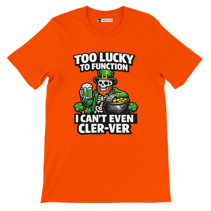Orange St. Patrick’s Day tee with skeleton leprechaun, beer, gold pot, shamrocks, and funny text 'Too Lucky to Function'