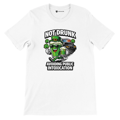 White tee with cartoon green beer, shamrocks, police car, and St. Patrick’s Day funny quote.