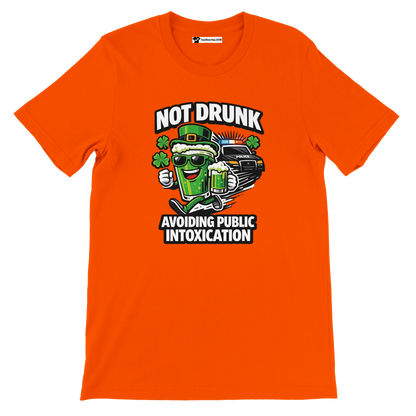 Orange graphic tee with cartoon beer mug, shamrocks, police car, and St. Patrick's Day slogan.