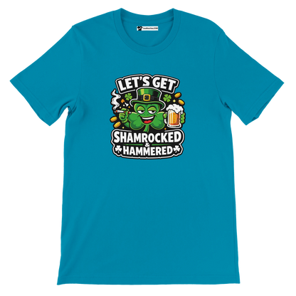 Blue t-shirt with cartoon shamrock, beer mug, gold coins and 'Let's Get Shamrocked & Hammered' text.