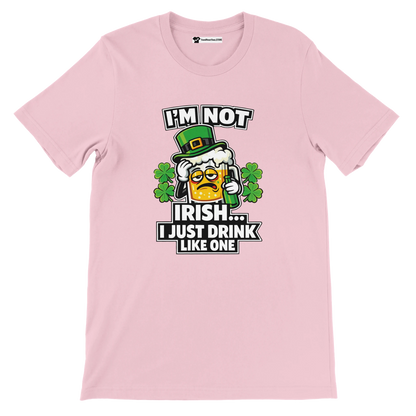 Pink St. Patrick's Day tee with funny 'I'm not Irish, I just drink like one' graphic, shamrocks, and beer mug.