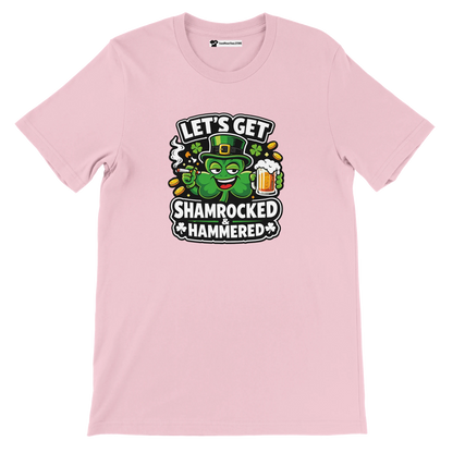Pink t-shirt with cartoon shamrock holding beer, festive St. Patrick’s Day quote graphic