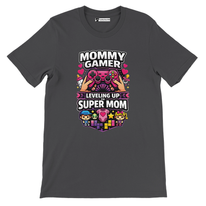 Dark tee with colorful pixel art, game controller, and 'Mommy Gamer Leveling Up to Super Mom' text.