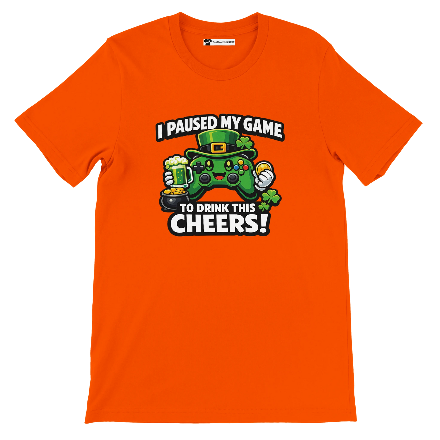 Orange t-shirt with St. Patrick's Day gamer graphic, green controller, text: I paused my game to drink this cheers, clover and beer mug design
