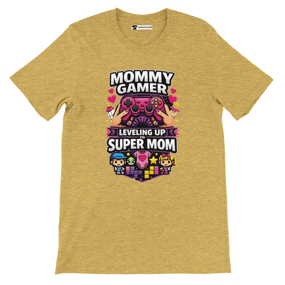 Yellow tee with gamer-themed design and text 'Mommy Gamer Leveling Up to Super Mom', pixel art icons.