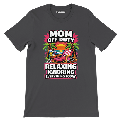 Grey tee with 'Mom Off Duty' quote, tropical beach chair, sunset, palm trees graphic.