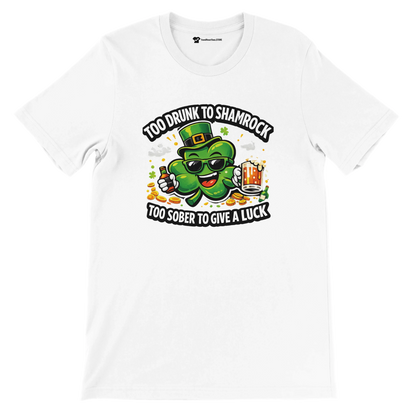 White t-shirt with a cartoon shamrock, sunglasses, beer, and the phrase 'Too drunk to shamrock, too sober to give a luck'