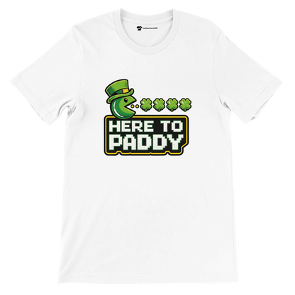 White St. Patrick's Day tee with Pac-Man graphic, green hat, shamrocks, and 'Here to Paddy' text