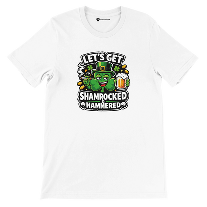 White t-shirt with cartoon shamrock holding beer, St. Patrick’s Day quote 'Let’s Get Shamrocked & Hammered'
