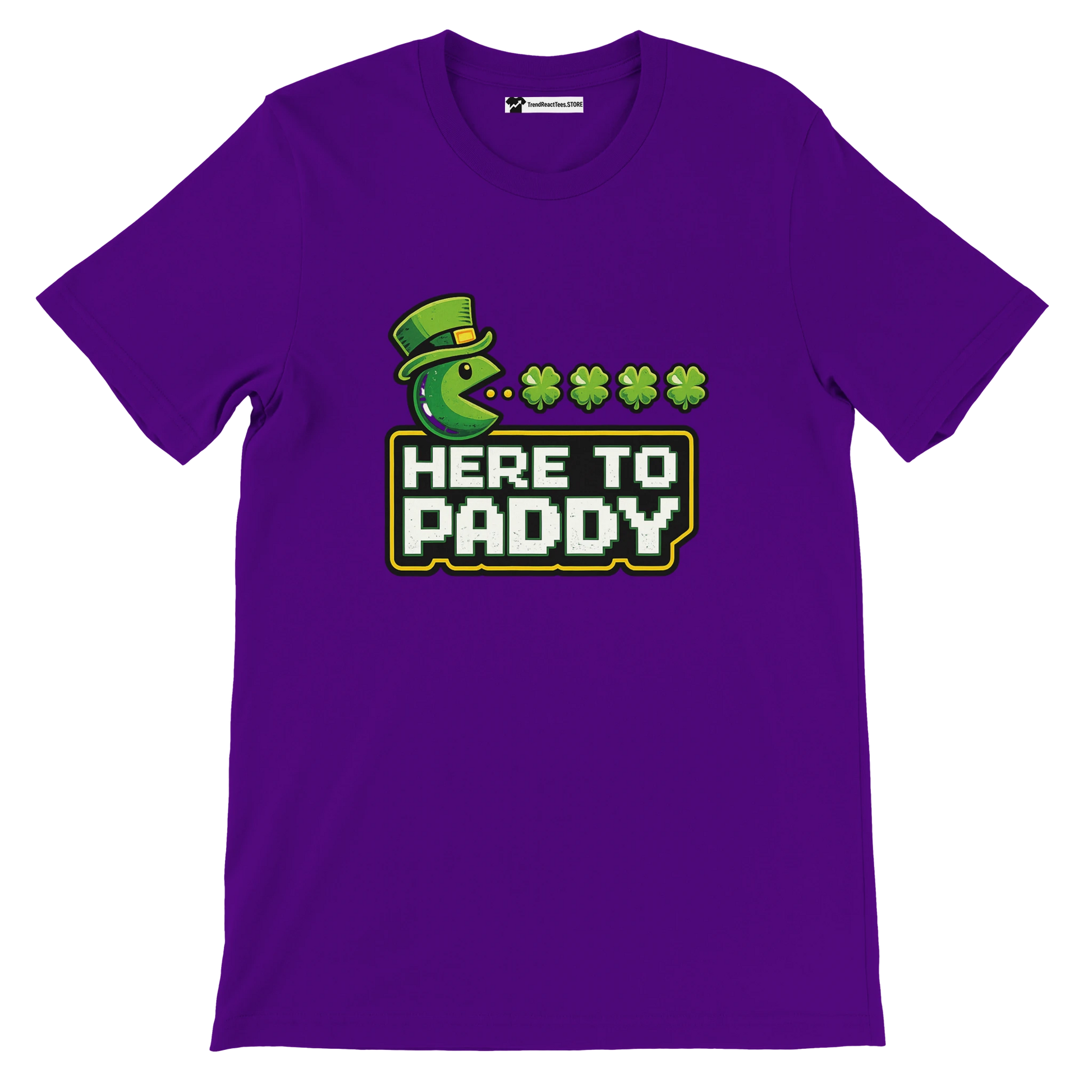 Purple tee with green Pac-Man in leprechaun hat, shamrocks, and 'HERE TO PADDY' text for St. Patrick's Day.