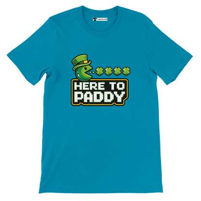 Blue St. Patrick's Day tee with Pac-Man eating shamrocks, 'Here to Paddy' text, leprechaun hat design
